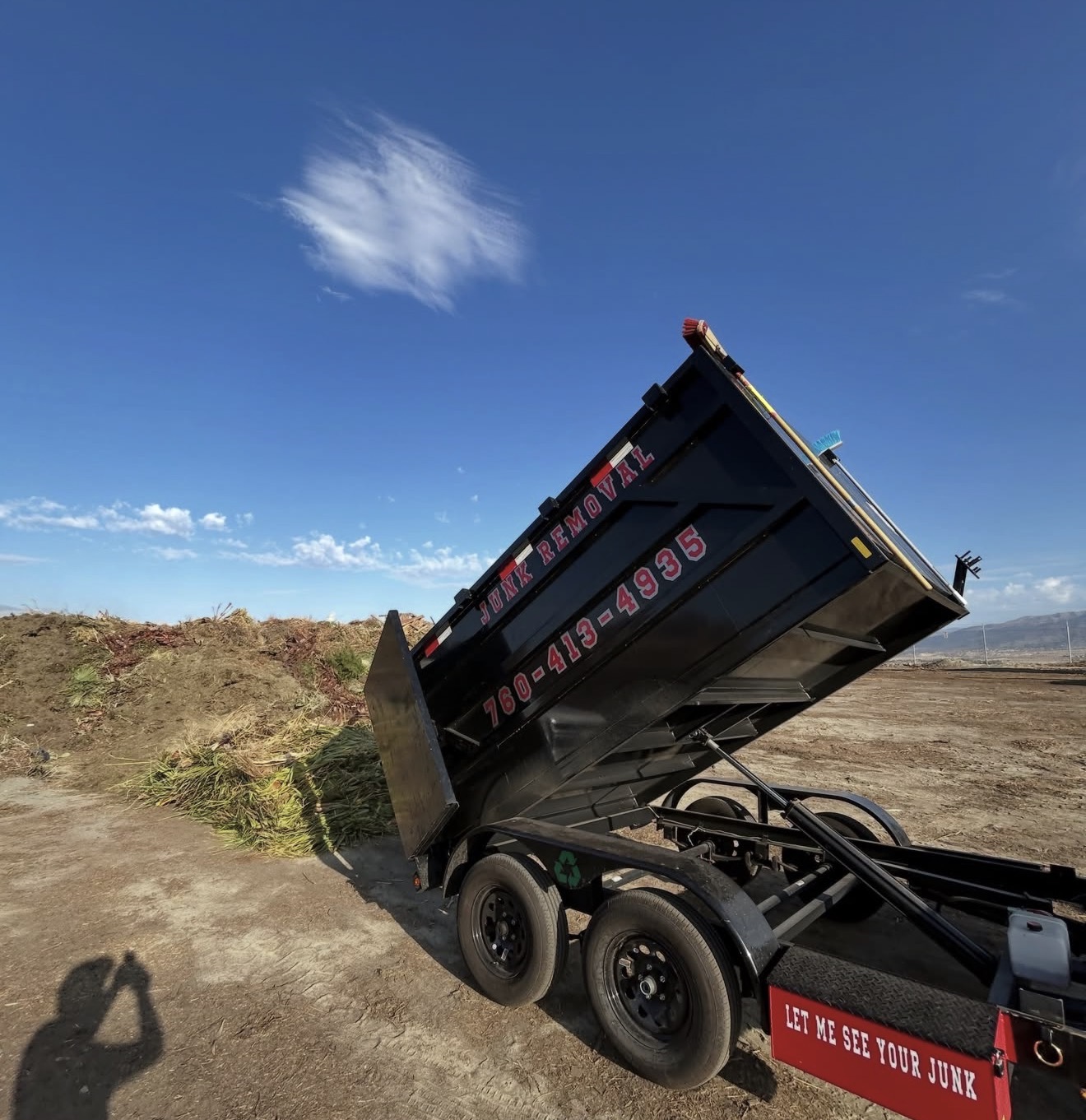 Supernova Hauling dump trailer unloading a load of green waste